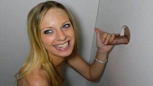 A girl sucked dick through a hole in the wall and received semen as a gift