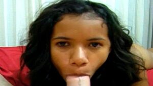 Asian chick sucks a big dick in front of the camera