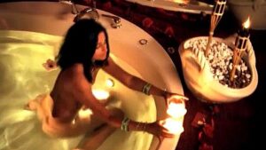 Beautiful Indian woman taking a spicy bath