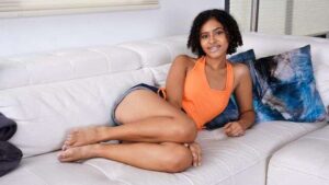 Cute mulatto with small tits gives herself pleasure with her fingers